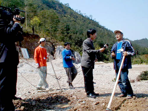 Tak being interviewed
