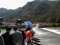 Walking over the narrow bridge at the ceremony