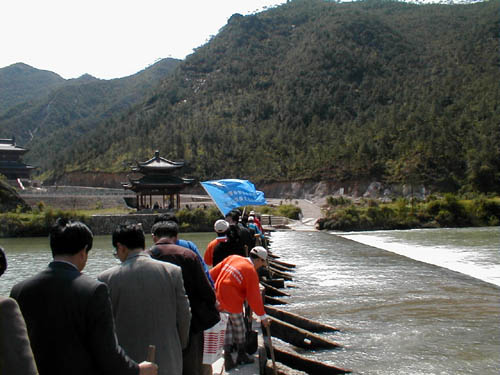 Walking over the narrow bridge at the ceremony