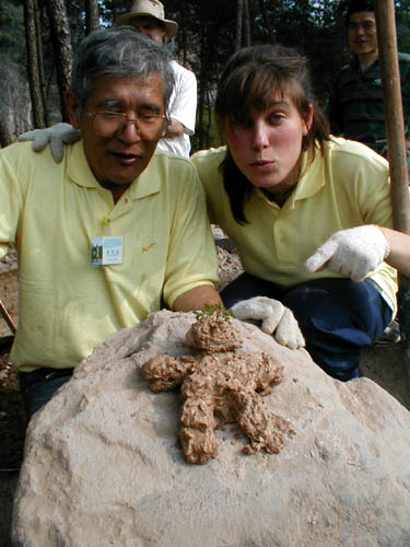 Mud man with parents